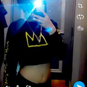 Black crop top with a crown on it